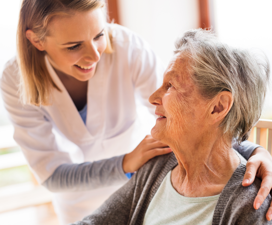 nurse put hands on shoulders of elder lady